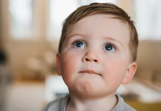young boy looking up