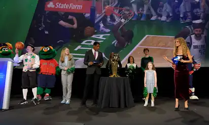 People standing on stage at Champions for Children's event