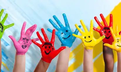 kids hands painted in bright colors 