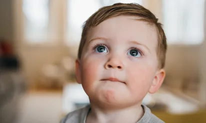 young boy looking up