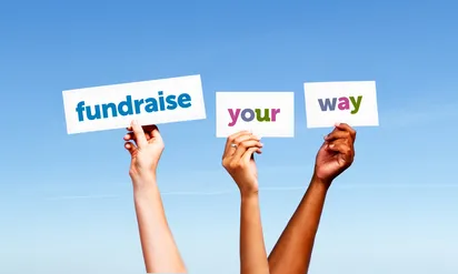 three hands hold up signs reading fundraise your way