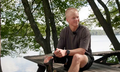 Jack sitting on a wooden table outdoors