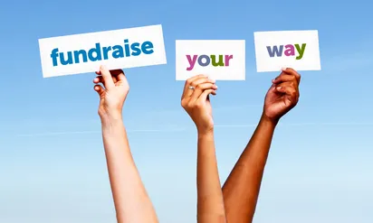 three hands hold up signs reading fundraise your way