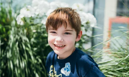 young boy smiling
