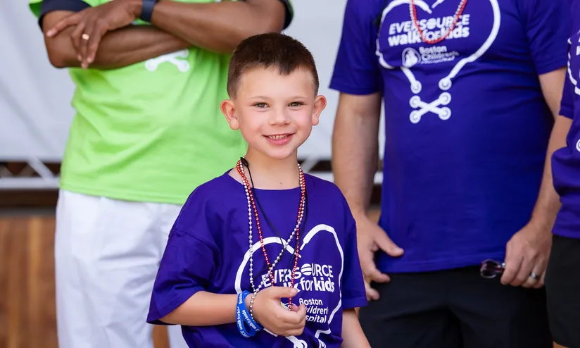 Nate, a Boston Children's Hospital patient, walking at the Eversource Walk