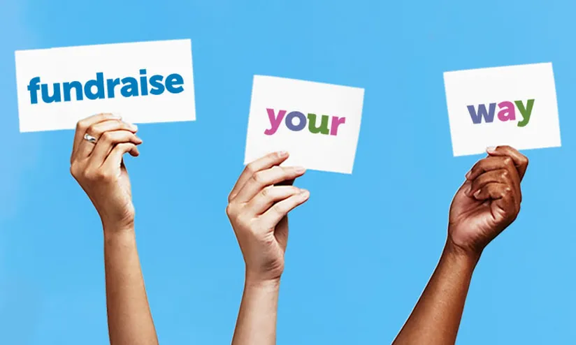 three hands hold up signs reading fundraise your way