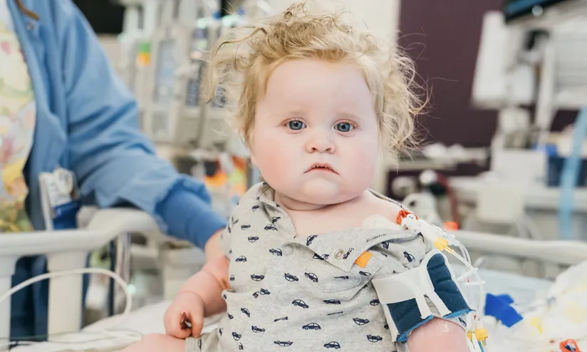 baby spencer on hospital bed