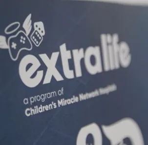 A sign that reads "extra life, a program of Children's Miracle Network"