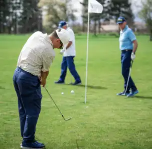 A group of men golfing