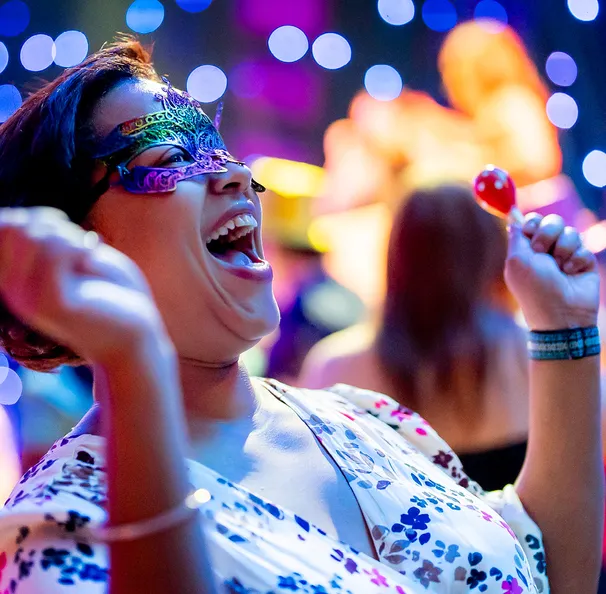 A woman smiling at laughing at the Milagros para Ninos Event for BCH
