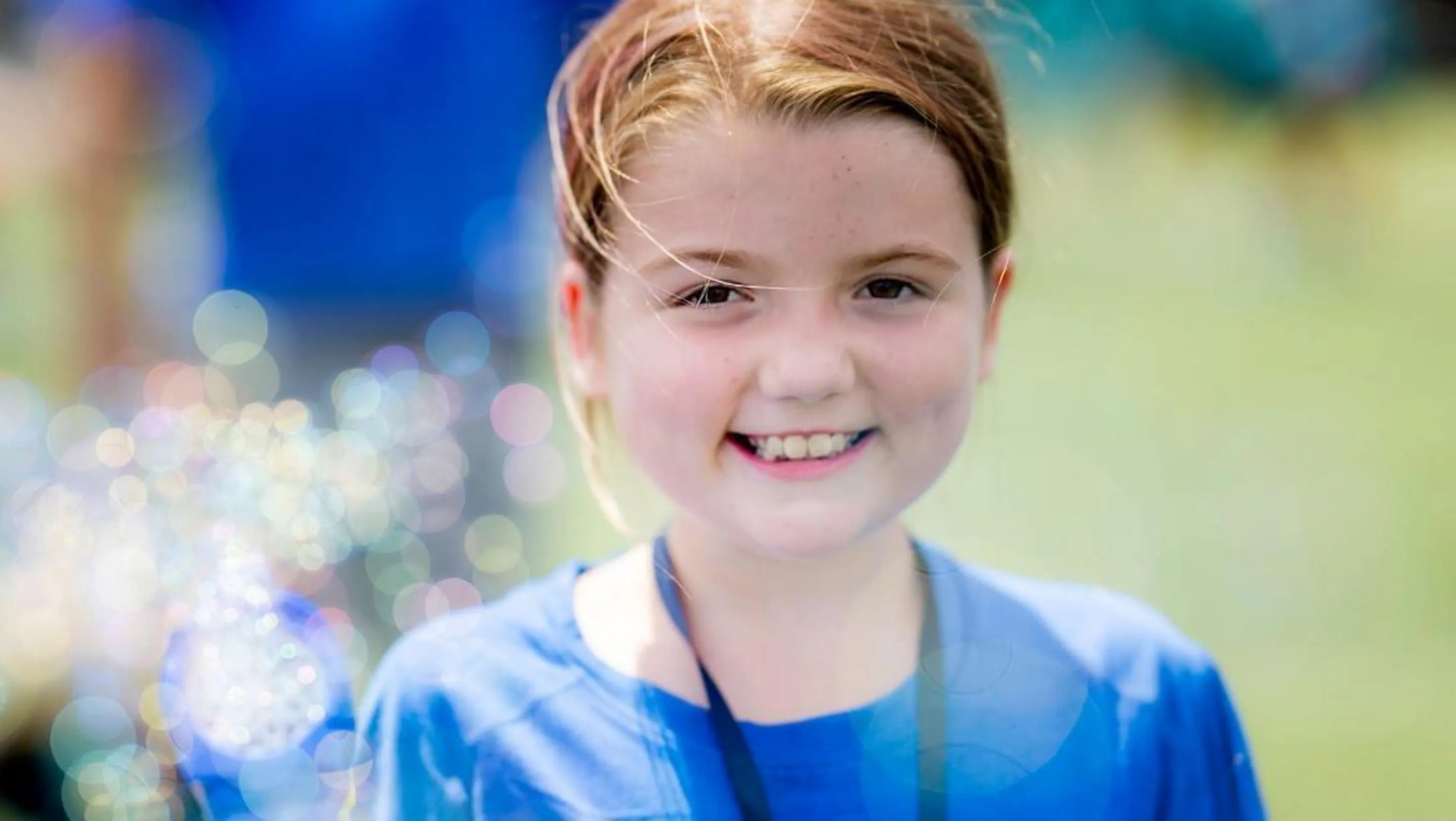 BCH patient Aileen smiles at the camera