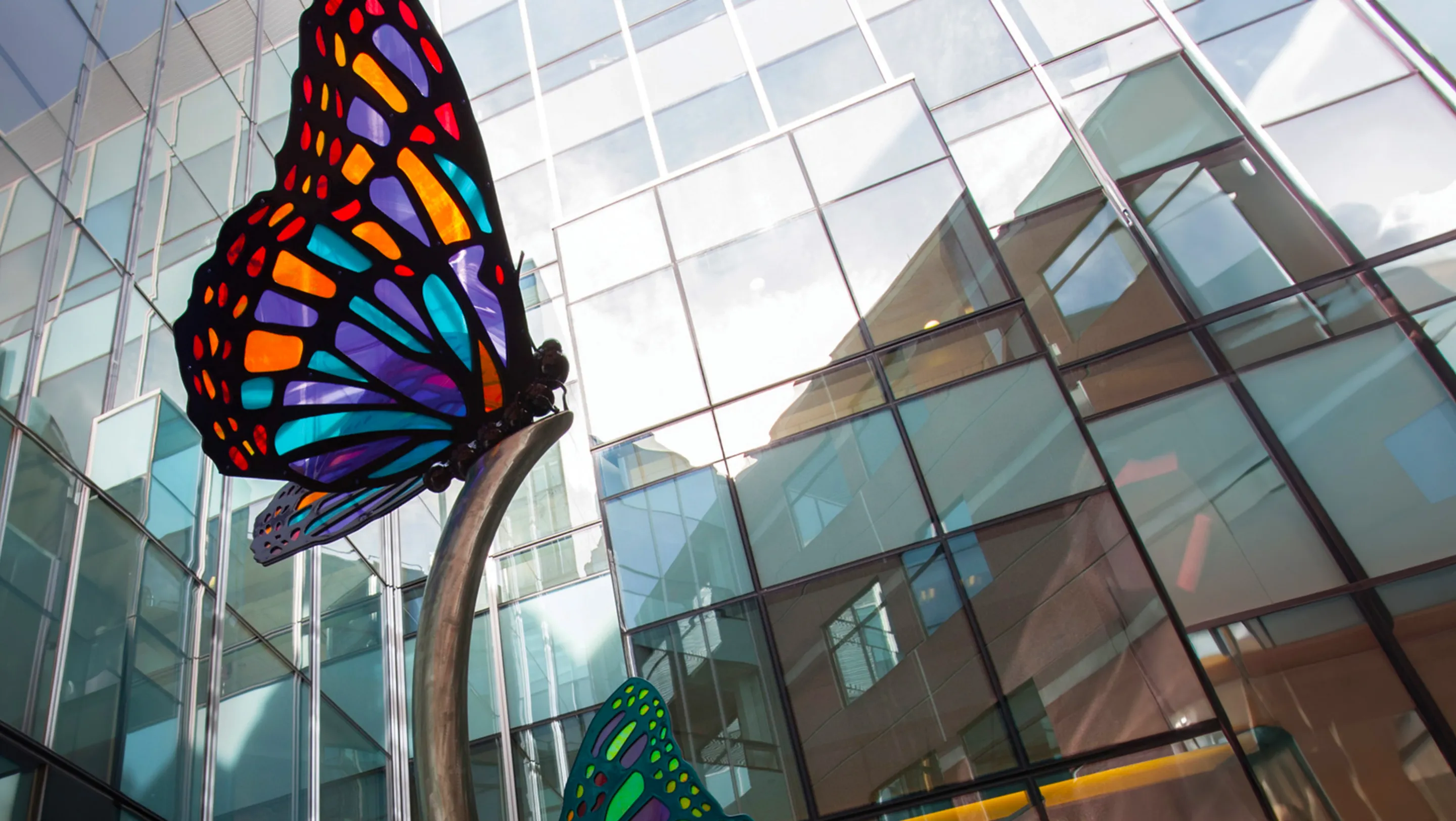 glass butterfly artwork inside building