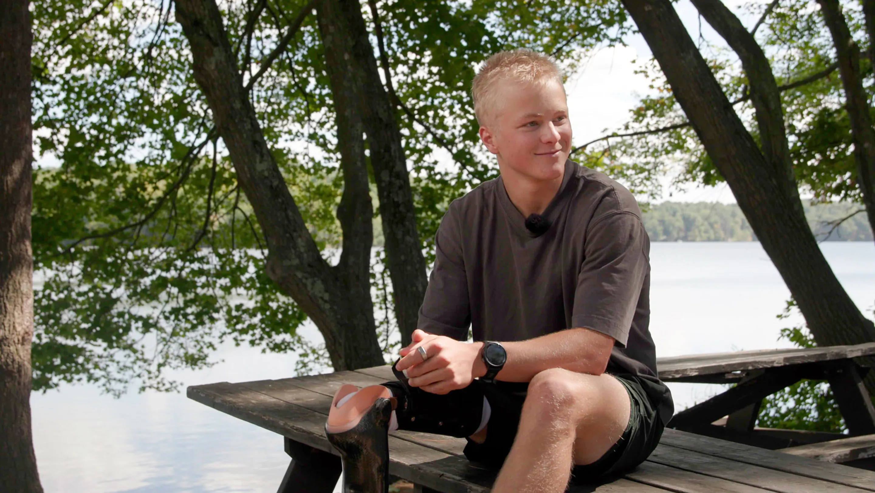 Jack sitting on a wooden table outdoors