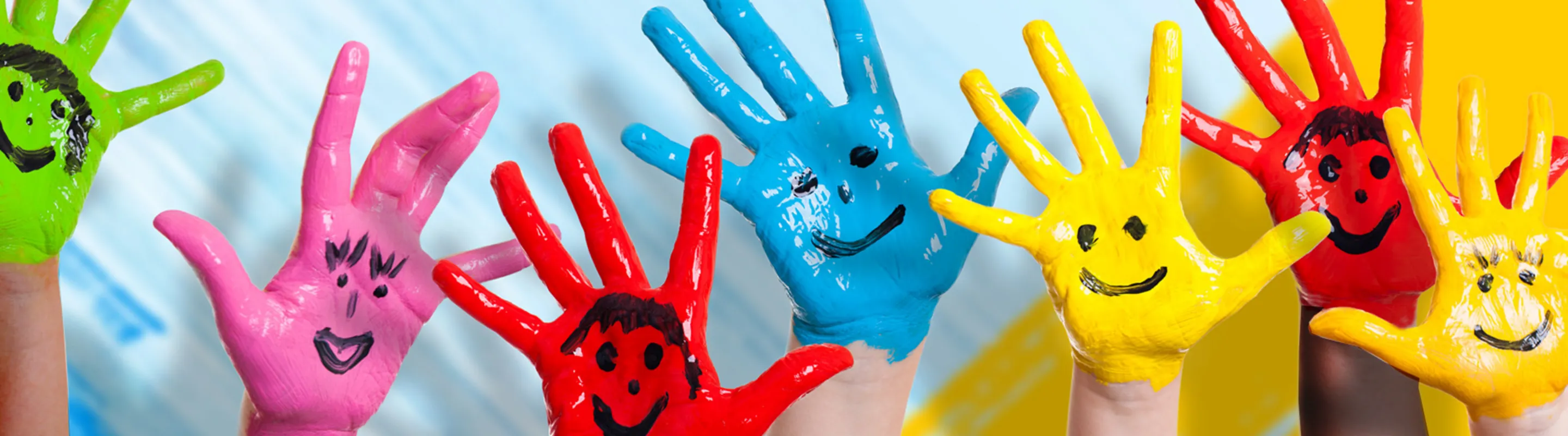 kids hands painted in bright colors 