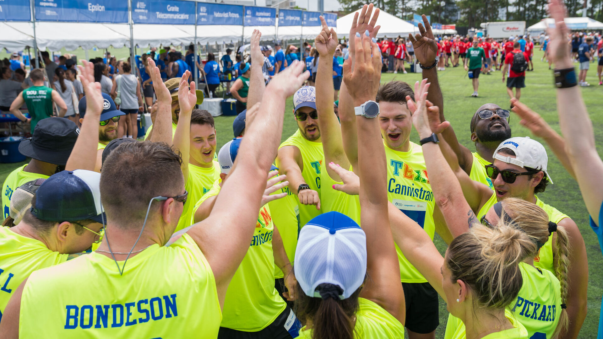 Participants playing sports give a cheer at Corporate Cup event for Boston Childrens Hospital
