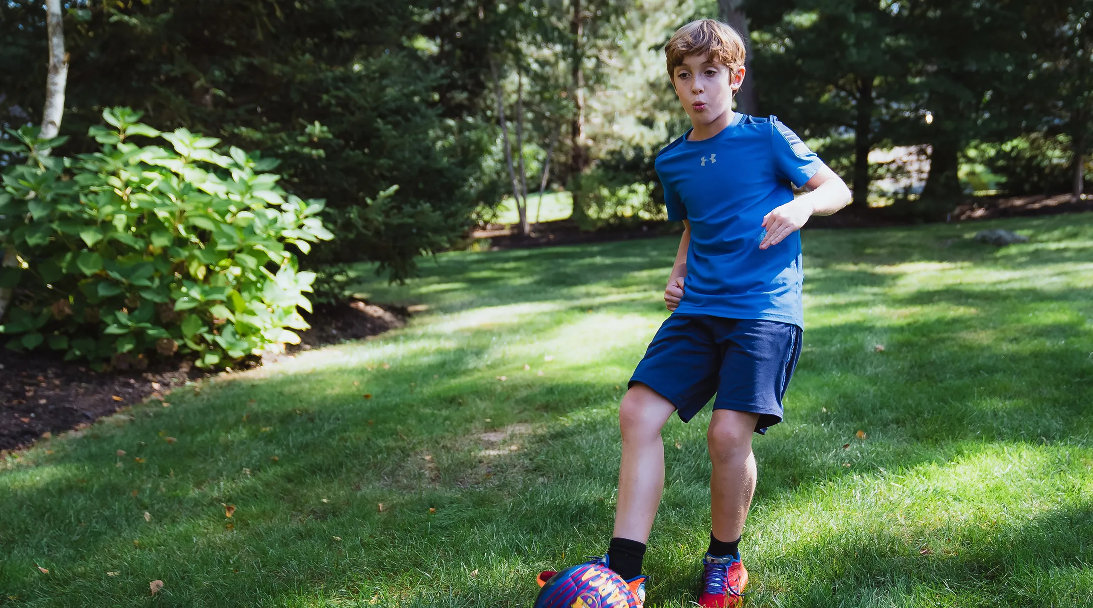 ryan playing soccer at park