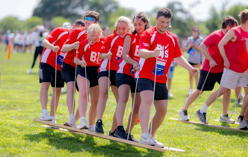Corporate team competing in athletic team building event