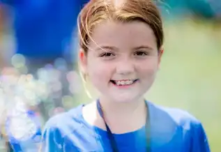 BCH patient Aileen smiles at the camera