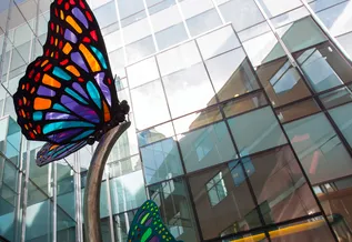 glass butterfly artwork inside building