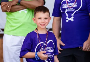 Nate, a Boston Children's Hospital patient, walking at the Eversource Walk