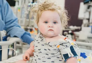 baby spencer on hospital bed